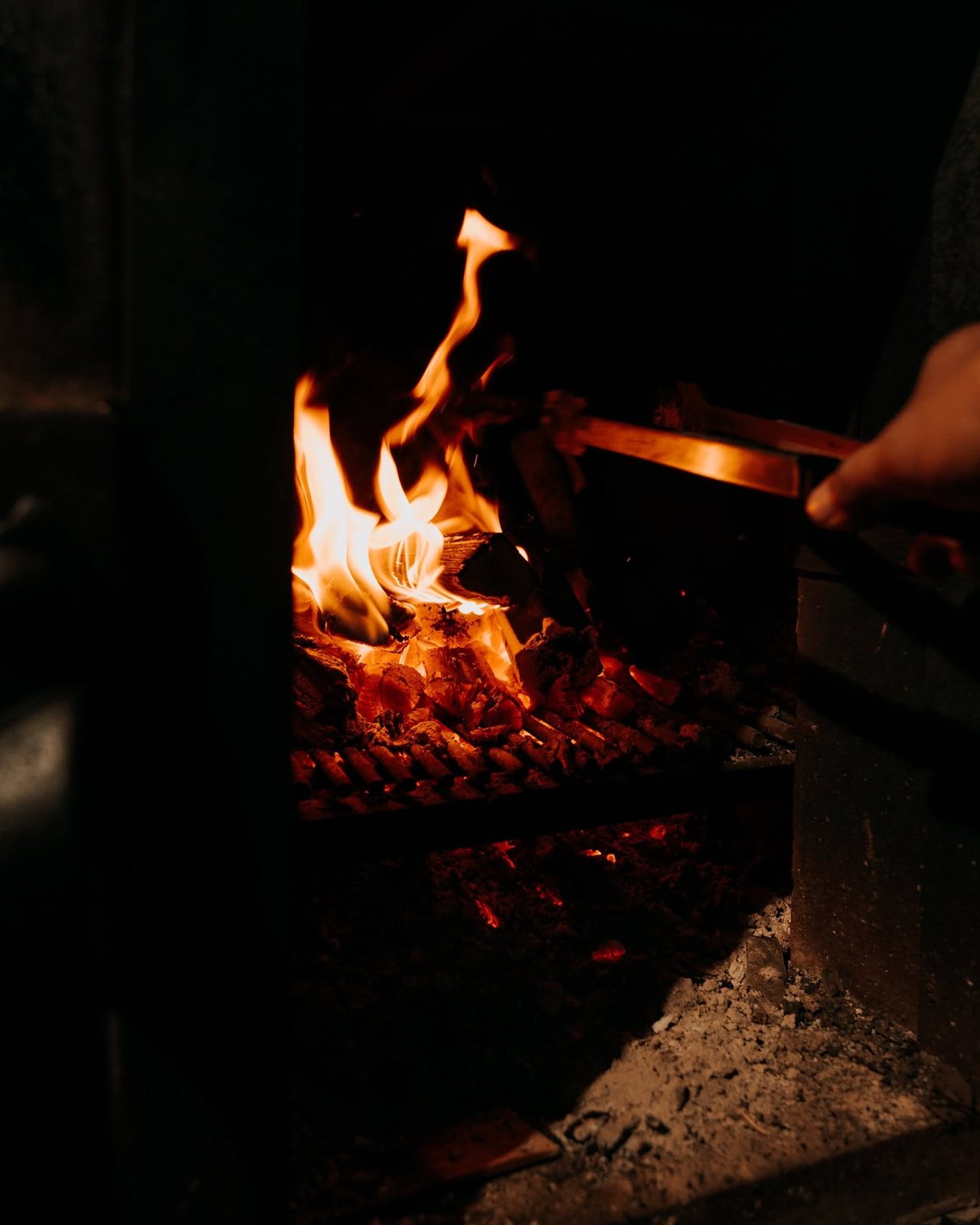 Charcoal fire inside a smoker