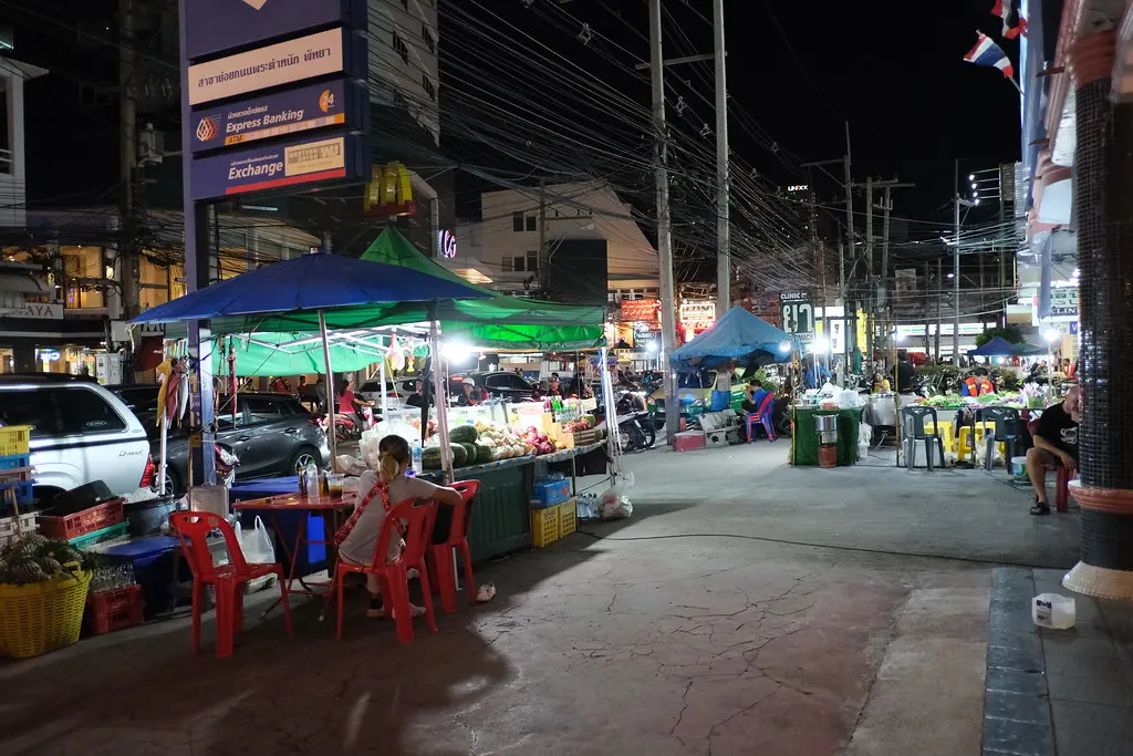 DSCF0783: an outdoor market at night with people shopping