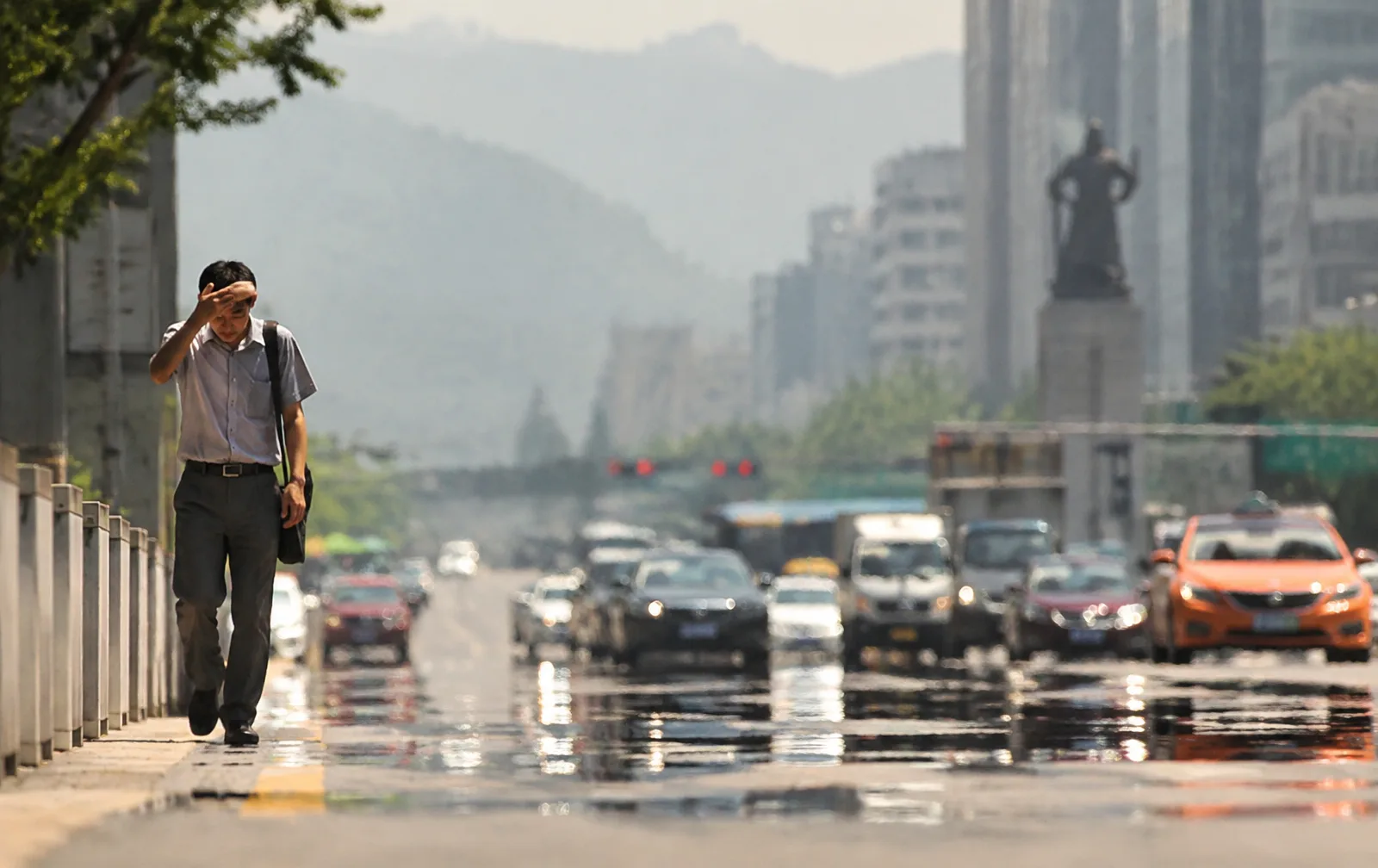 Heat haze shimmers above a Seoul street during the record-hot summer of 2026